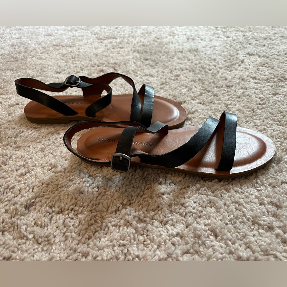 Lucky Brand black leather strappy sandals. BRAND NEW W/ TAGS. Size 5.
